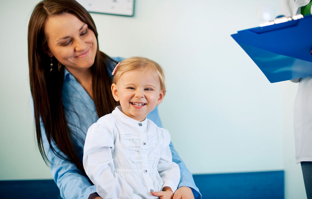 Mother and child at the doctors office. 